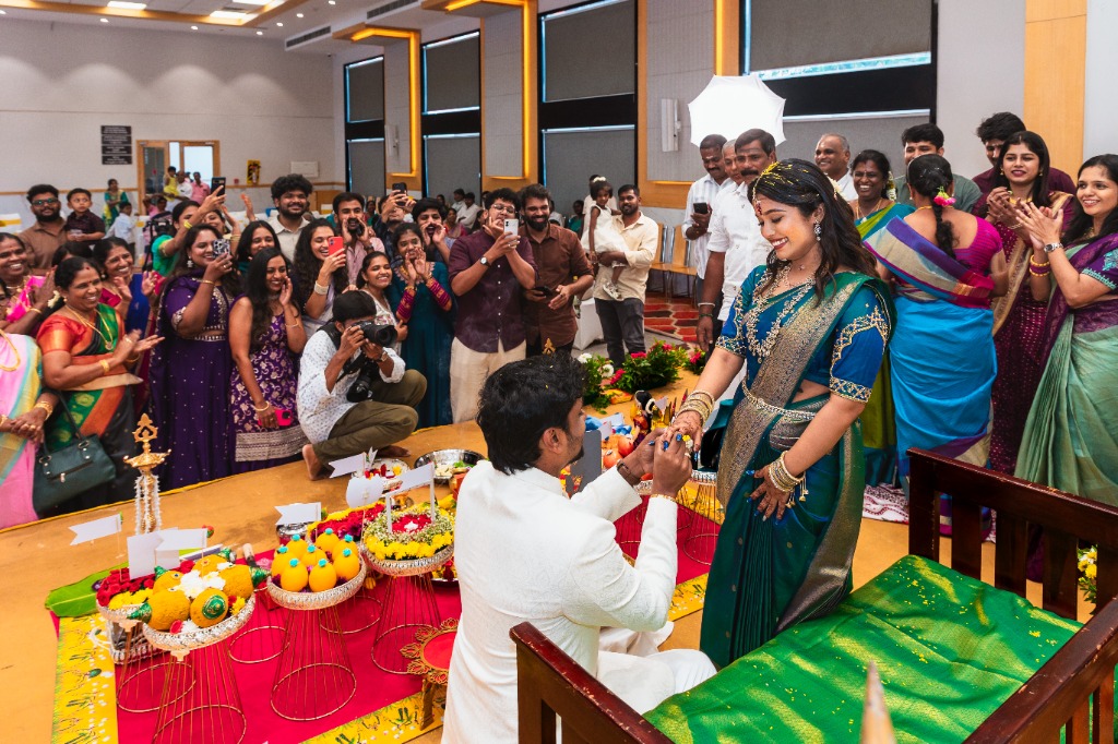 Engagement — Full hall celebration with guests cheering