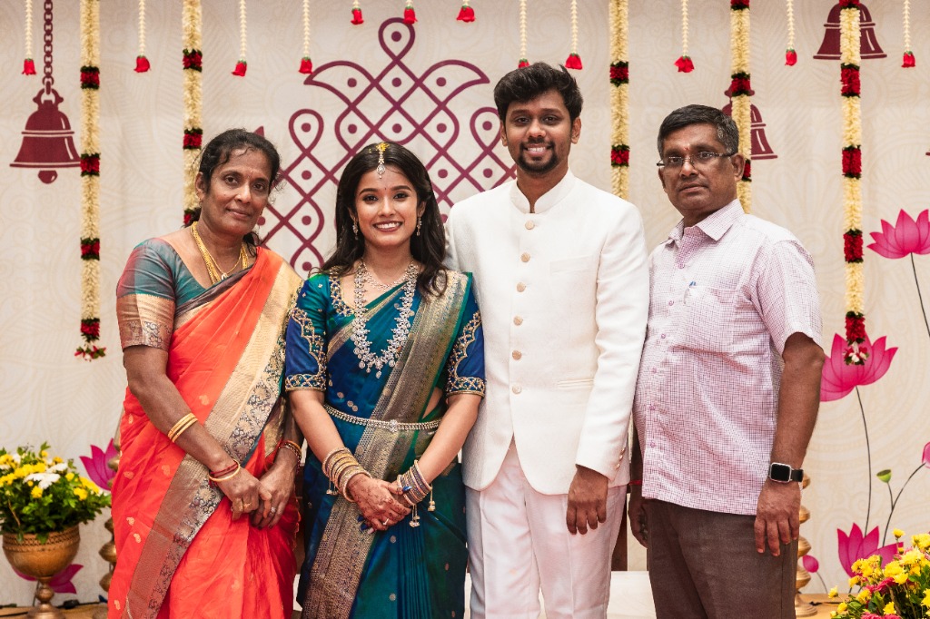Engagement — Couple with Groom's parents on stage