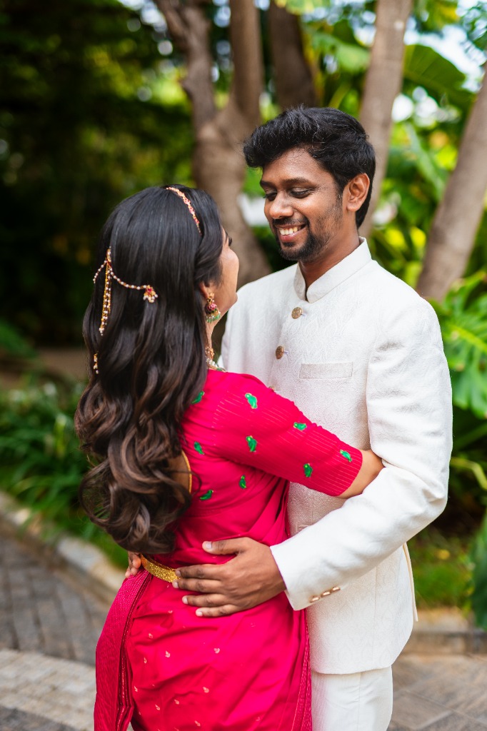 Pre-Wedding — Groom smiling looking at Bride from behind