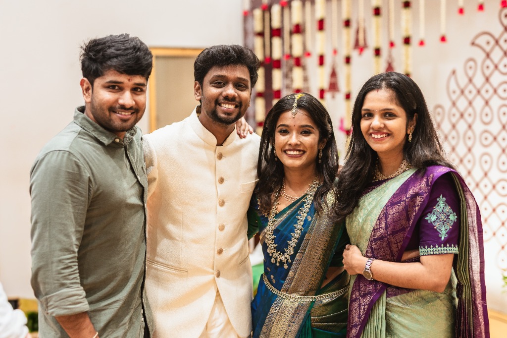 Engagement — Couple with friends candid group photo at venue