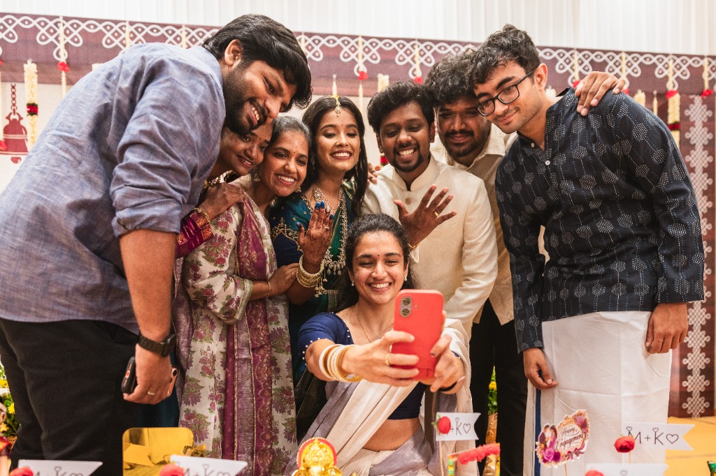 Engagement — Group selfie with couple and friends at venue